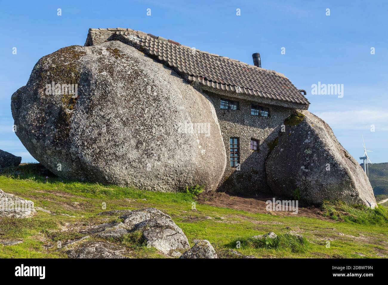Casa do Penedo, a house built between huge rocks on top of a mountain ...