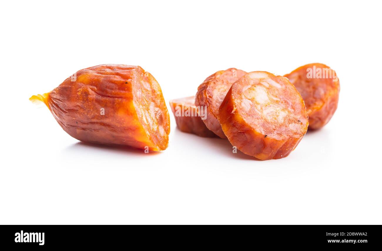 Sliced mini salami sausages isolated on white background Stock Photo