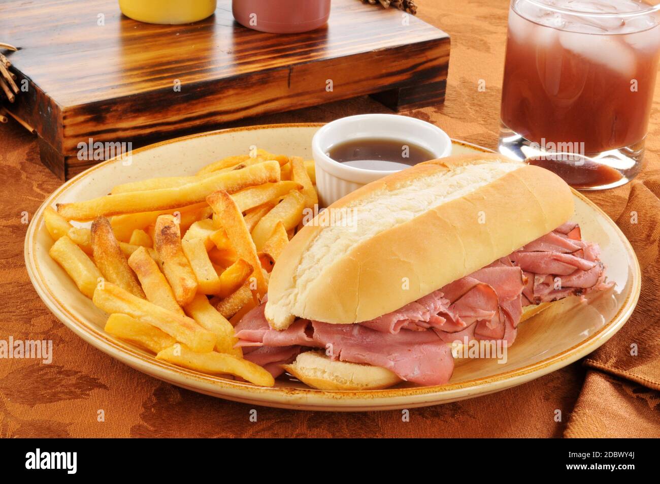 A roast beef sandwich au jus with fries Stock Photo Alamy