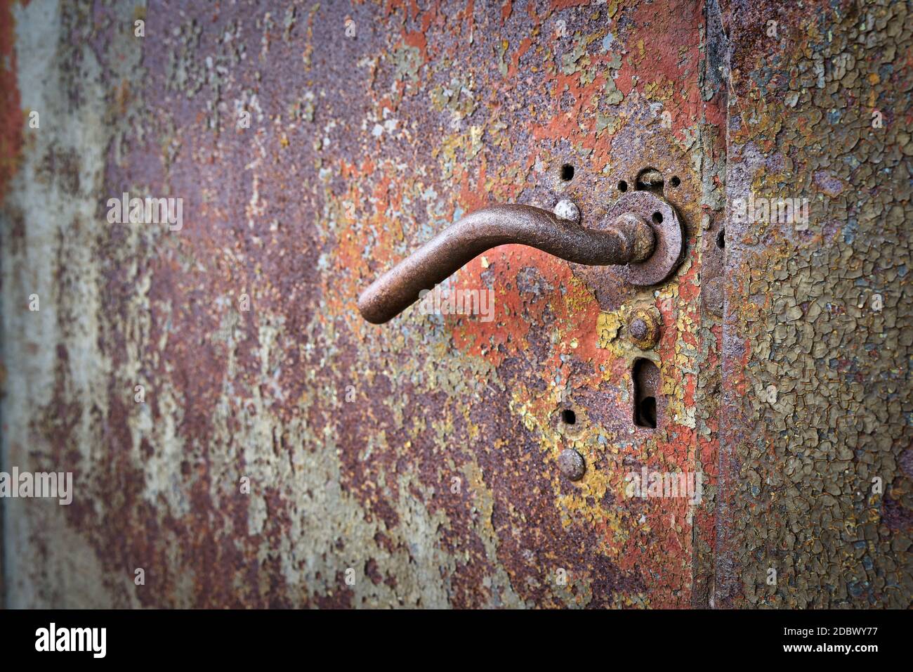 Door handle on an old metal door in the port of Magdeburg Stock Photo