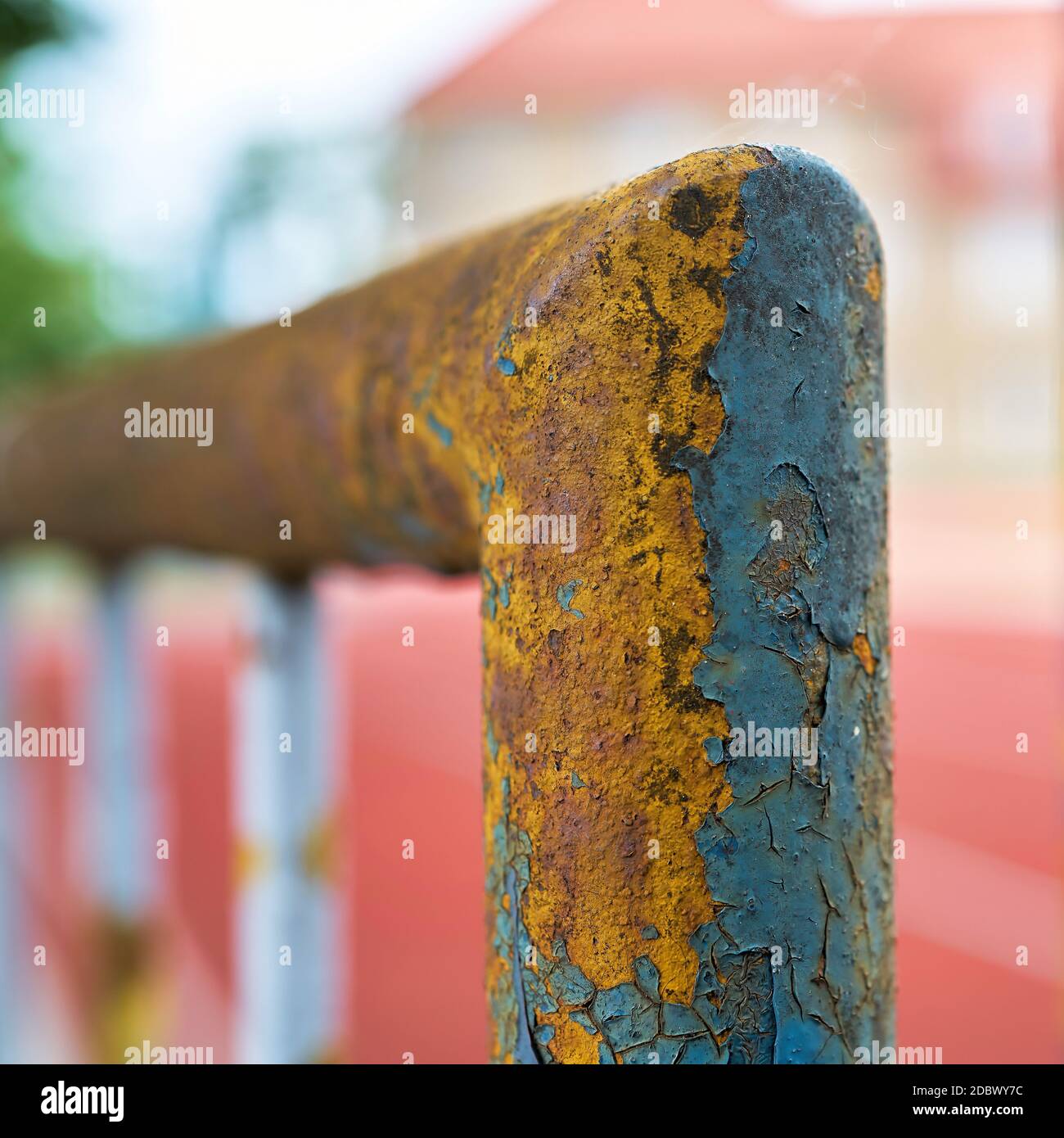 paint flaking off an old dilapidated rusty fence Stock Photo