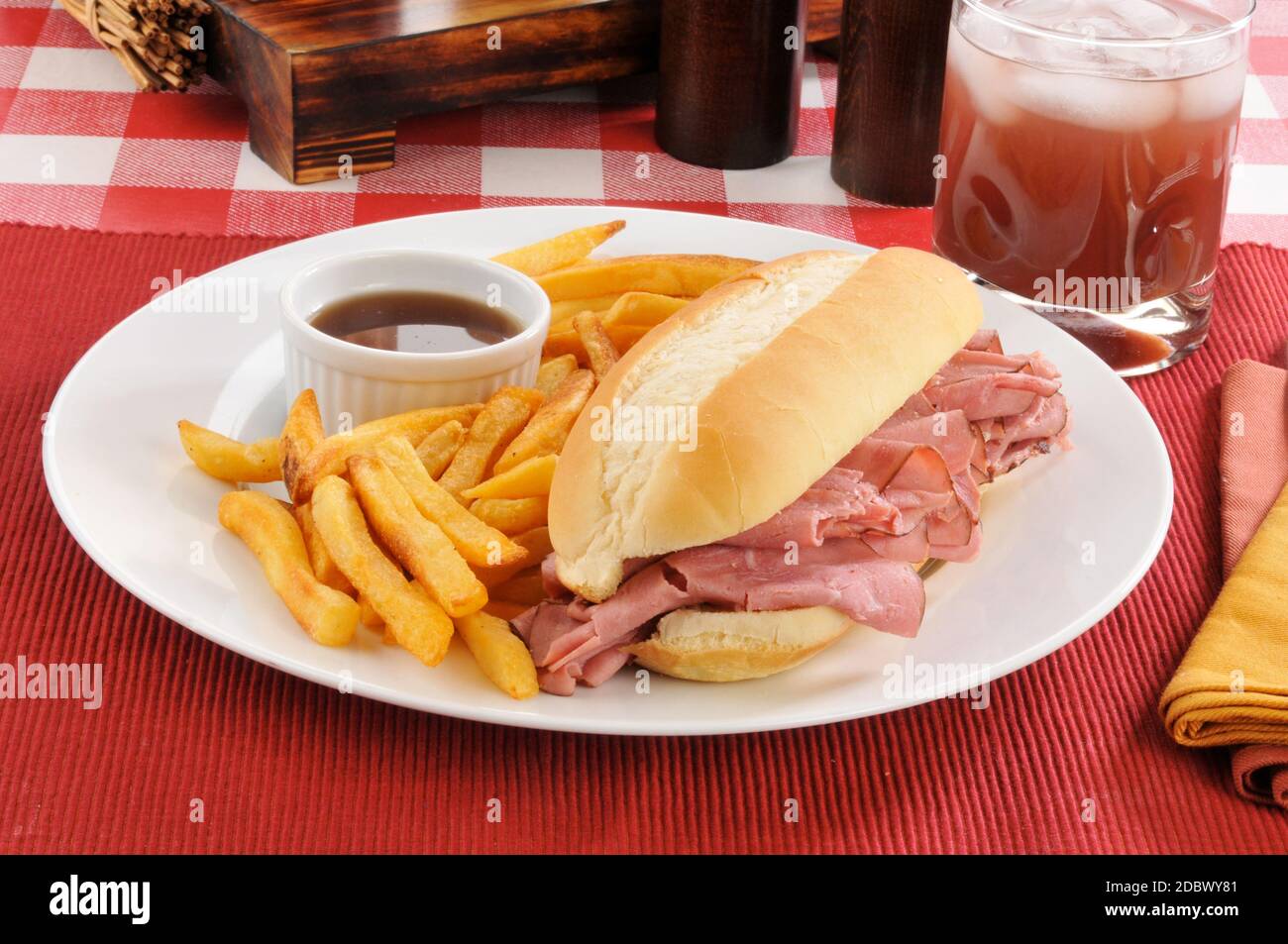 A roast beef sandwich au jus with fries Stock Photo Alamy