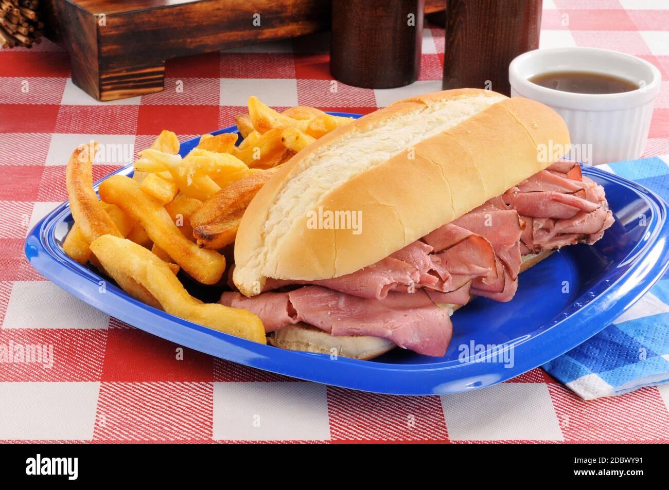 Roast beef sandwich au jus on a picnic table Stock Photo Alamy