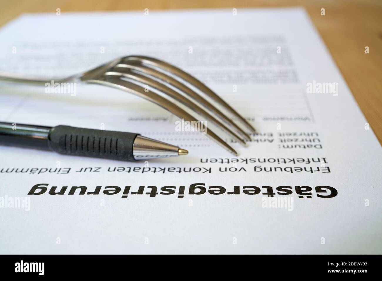 Form for guest registration (GÃ¤steregistrierung) in a restaurant in Germany during the Corona pandemic Stock Photo