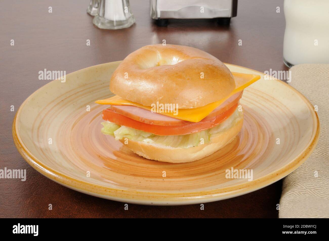 A ham and cheese sandwich on a plain bagel Stock Photo Alamy
