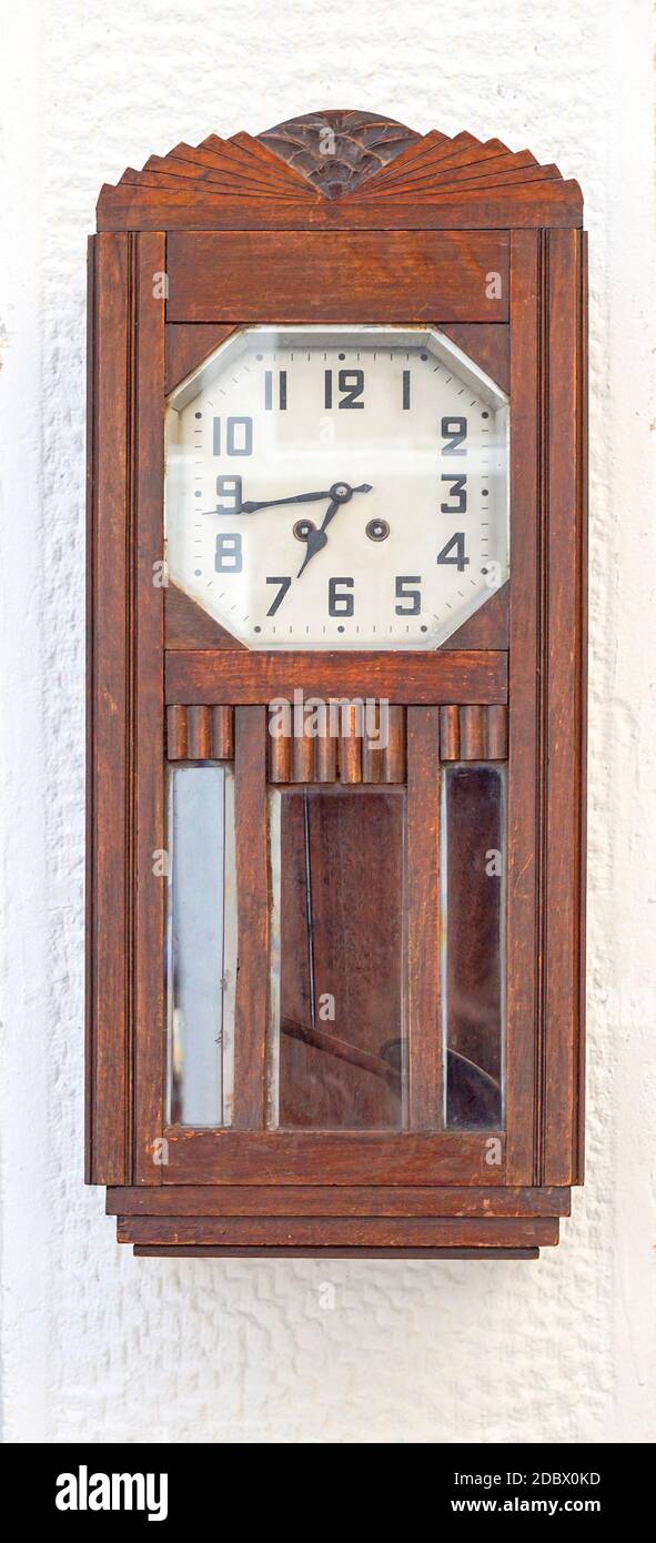Wooden grandfather clock with pendulum at wall Stock Photo Alamy