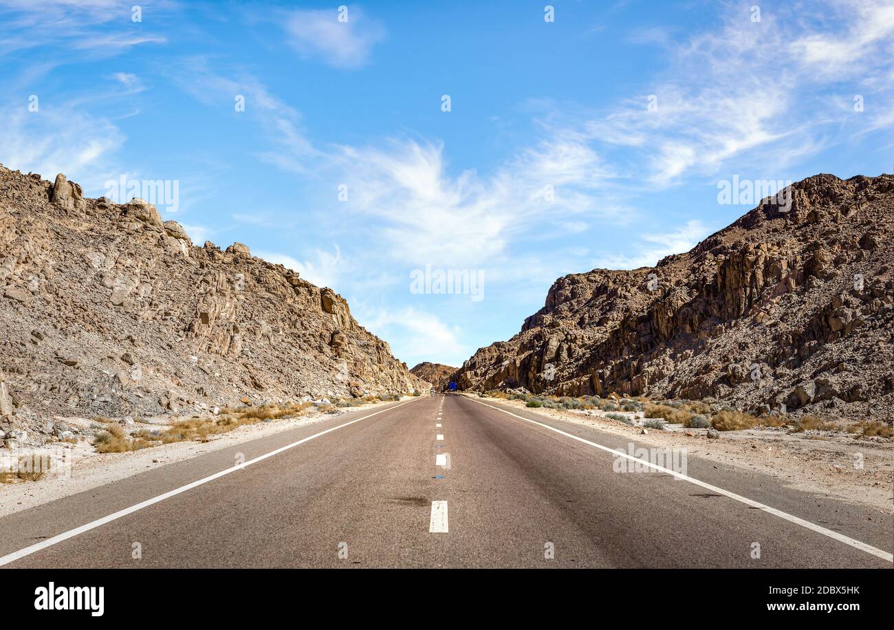 Speed highway through Egyptian mountains in desert Stock Photo