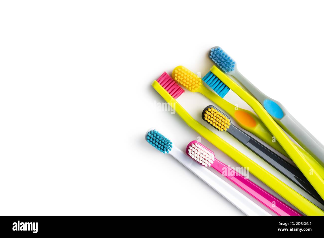 Various colorful toothbrushes isolated on white background. Stock Photo