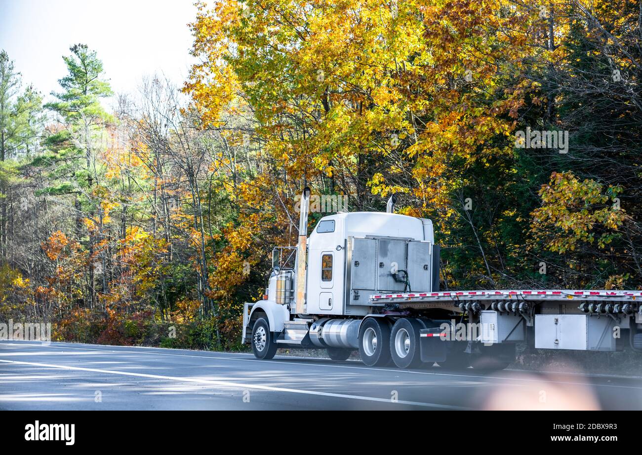 Classic white long hauler big rig industrial semi truck tractor with ...