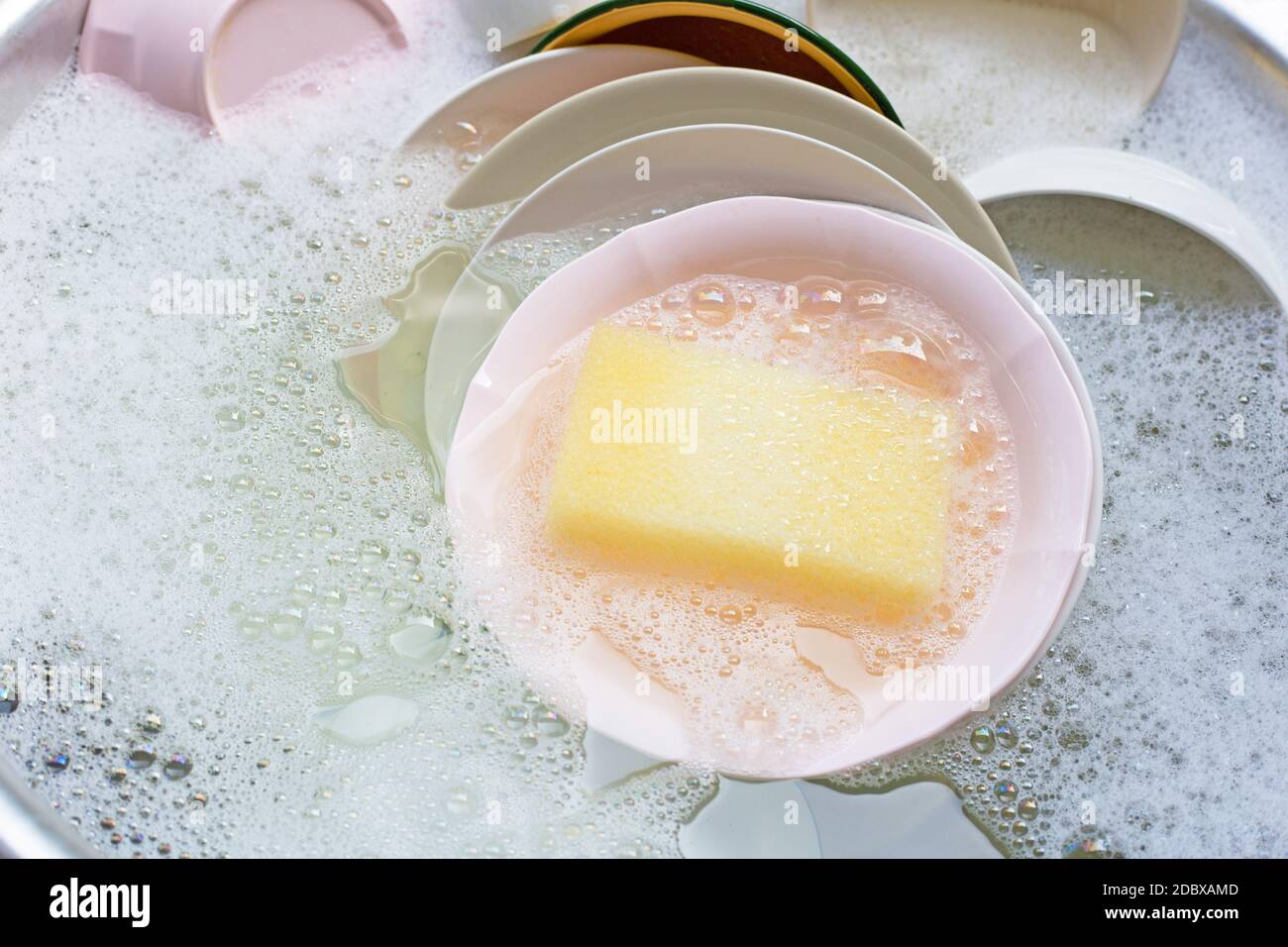 Washing dishes, Close up of utensils soaking in kitchen sink Stock Photo Alamy