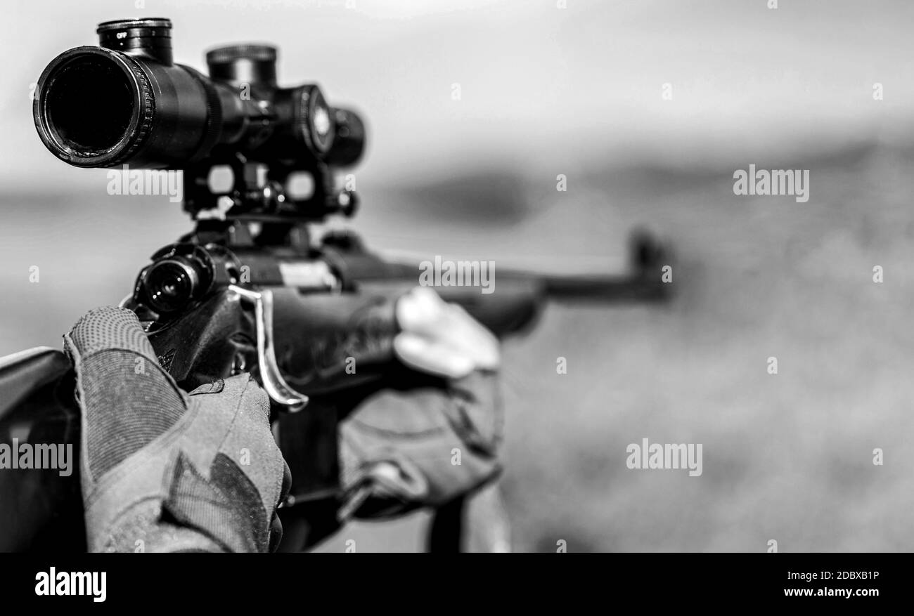 Hunt hunting rifle. Hunter man. Hunting period. Male with a gun. Close