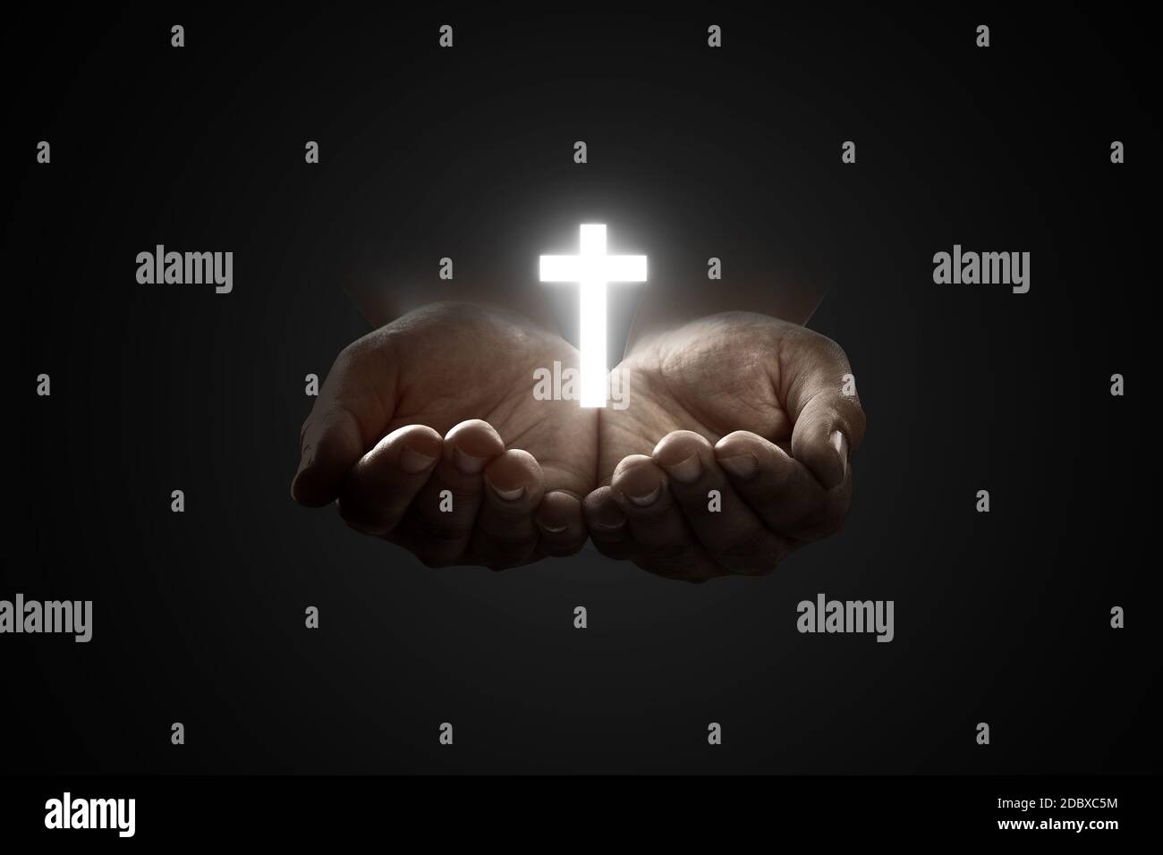 Human hands praying to god with shiny Christian Cross over black background  Stock Photo - Alamy