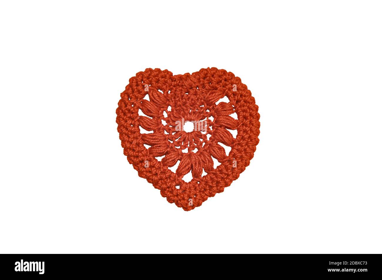 Heart knitted from red threads on a white background Stock Photo - Alamy
