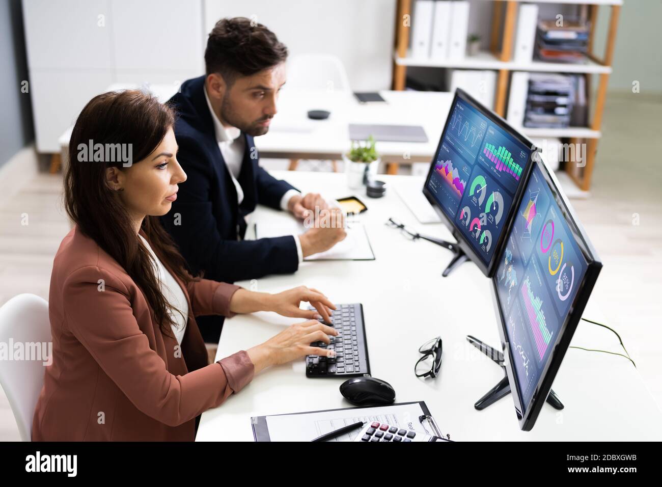 Financial Advisor And Business Analyst Working On Computer Stock Photo