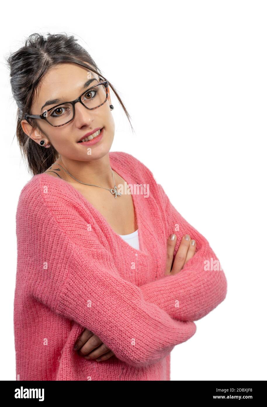 young smiling brunette woman with a pink sweater isolated on white background Stock Photo
