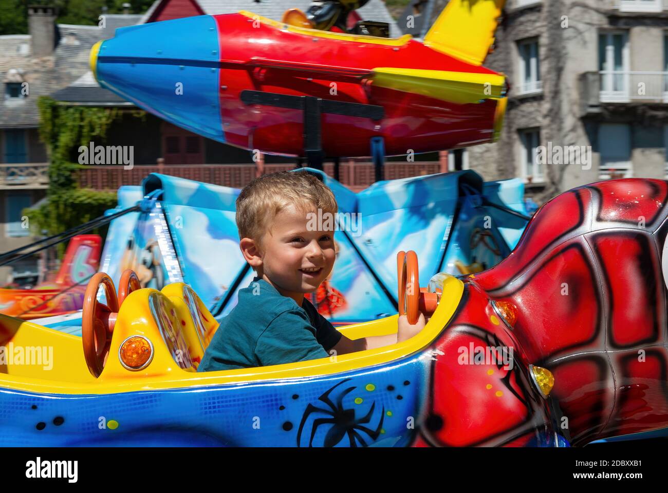 a portrait of little boy in a merry-go-round Stock Photo