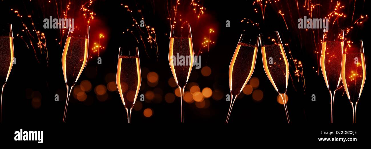 Celebration with champagne in front of red glittering fireworks sky and golden bokeh. Horizontal background for silvester and wedding. Special occasio Stock Photo