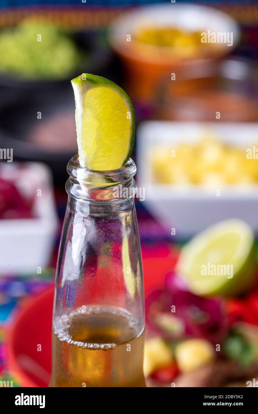 lime in a beer with mexican tortilla and salsas Stock Photo Alamy