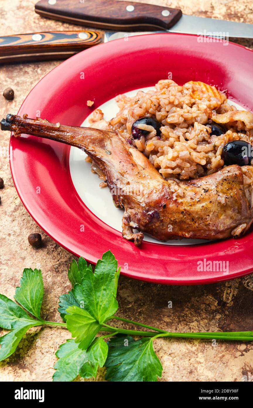 Pilaf with stewed rabbit.Risotto with hare.Italian Cuisine Stock Photo Alamy