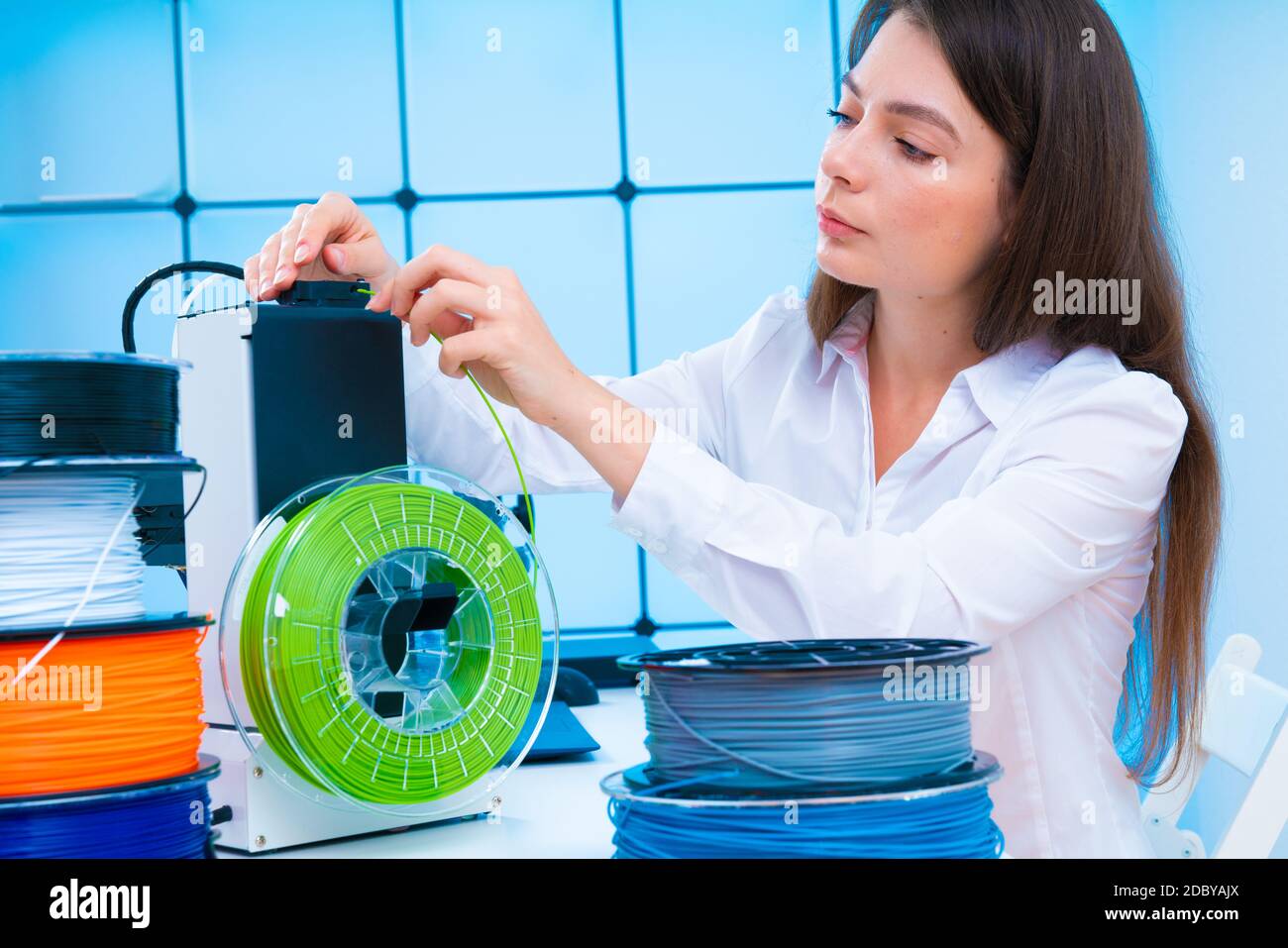 Young woman use 3d printer at office High quality photo Stock Photo - Alamy