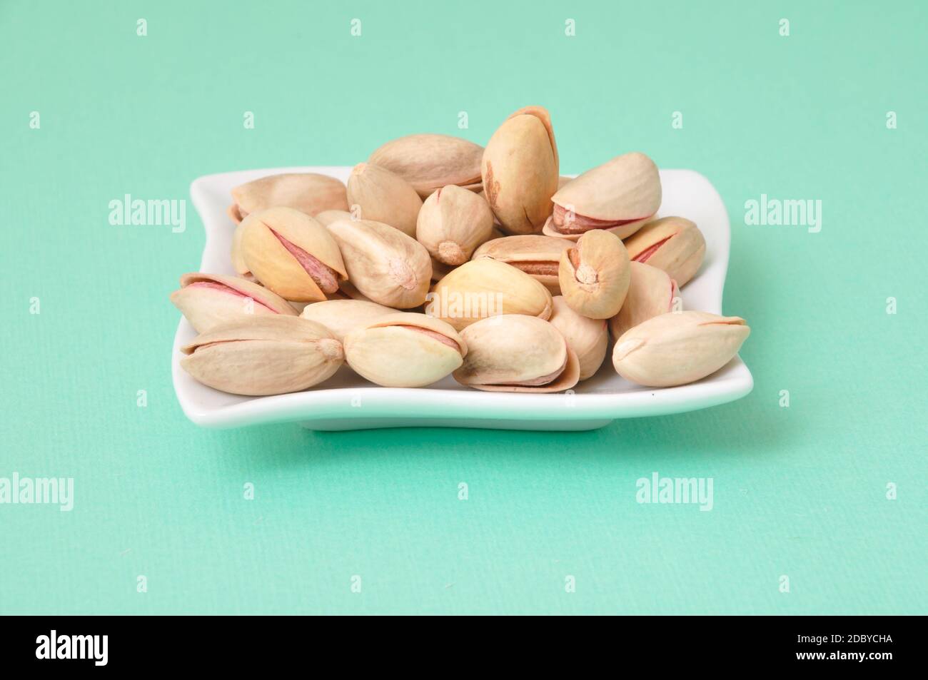 Pistachio nut in a cup Stock Photo Alamy