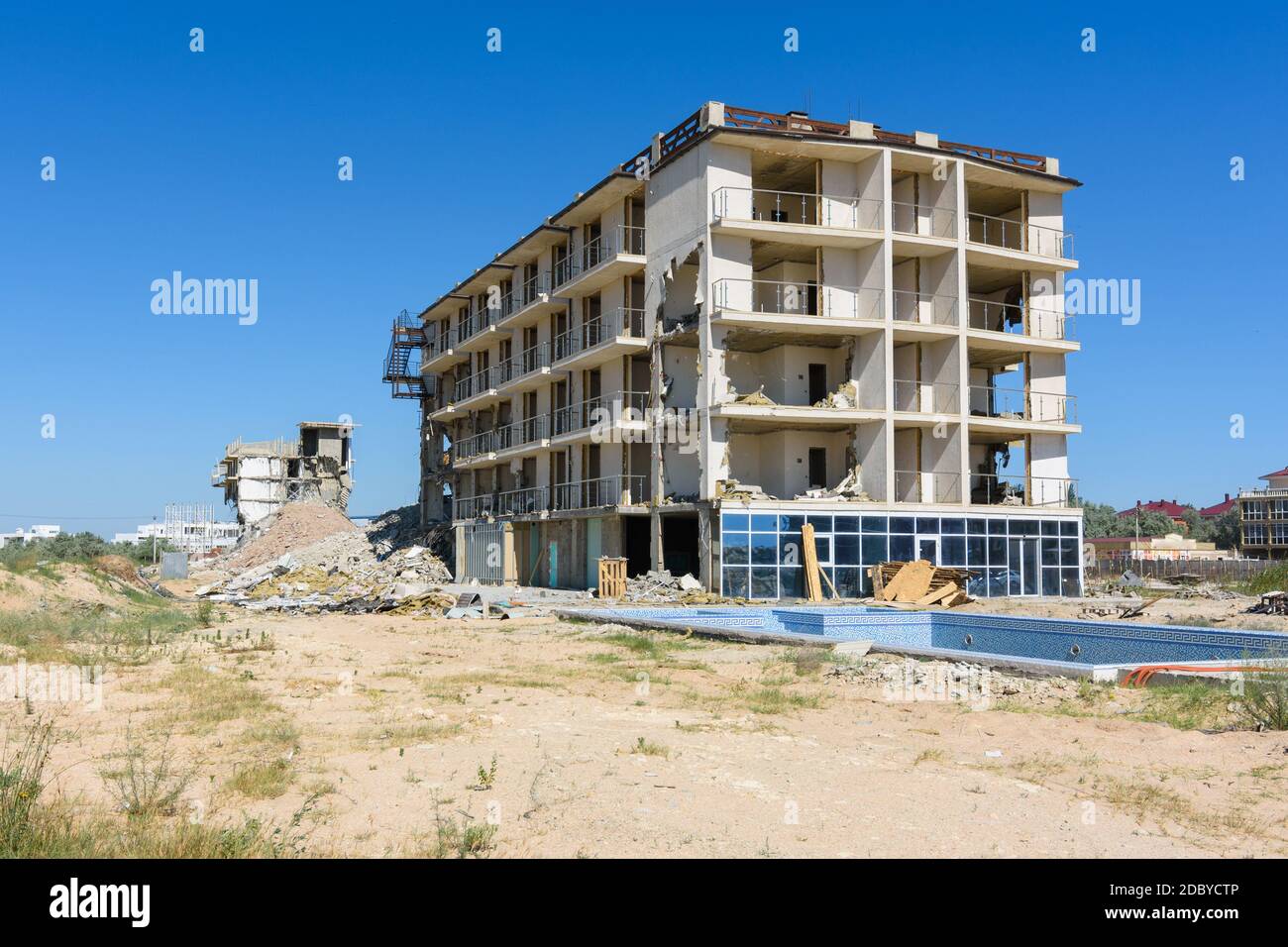 Illegal construction on the coastal side, demolition of the hotel complex Stock Photo