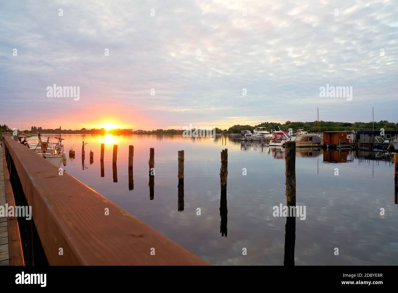 Evening mood with sunset at a boat landing stage in TÃ¶plitz an der Havel in Germany Stock Photo