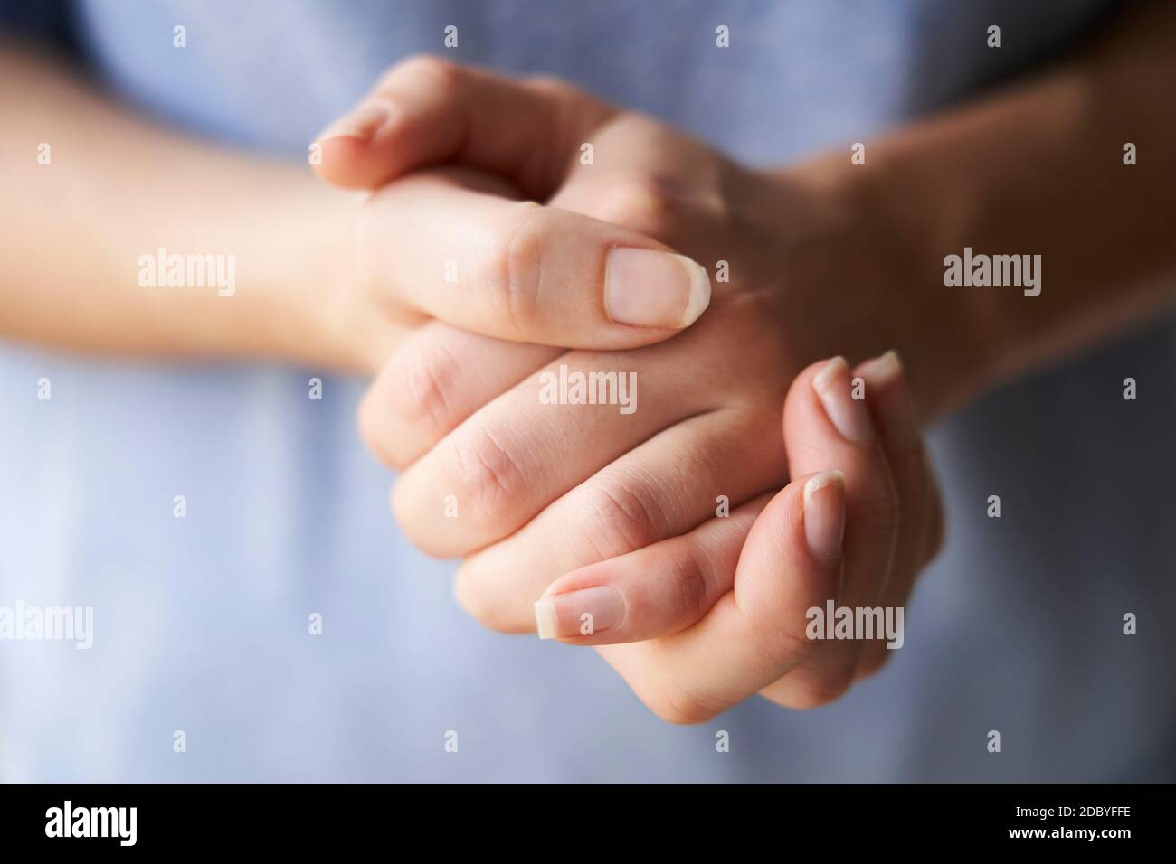 Woman rubbing hands together hires stock photography and images Alamy