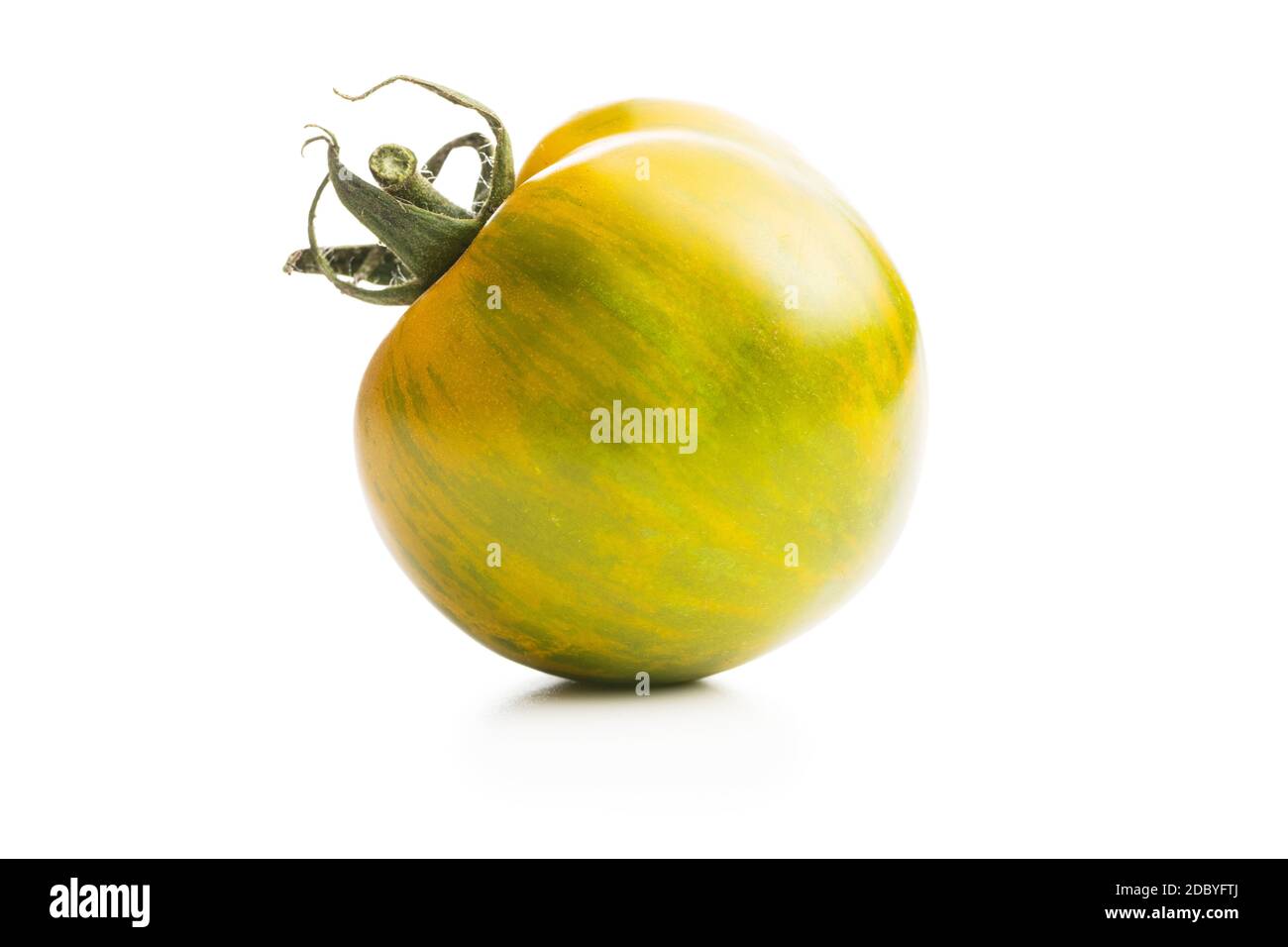 Green zebra tomato isolated on white background. Stock Photo