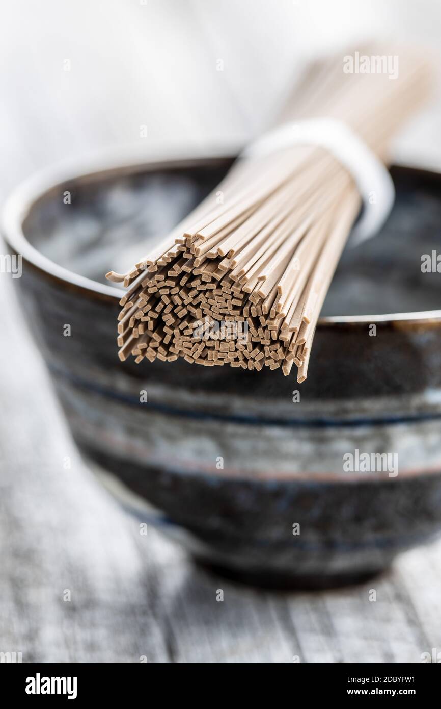 Uncooked soba noodles. Traditional Japanese noodles on bowl Stock Photo Alamy