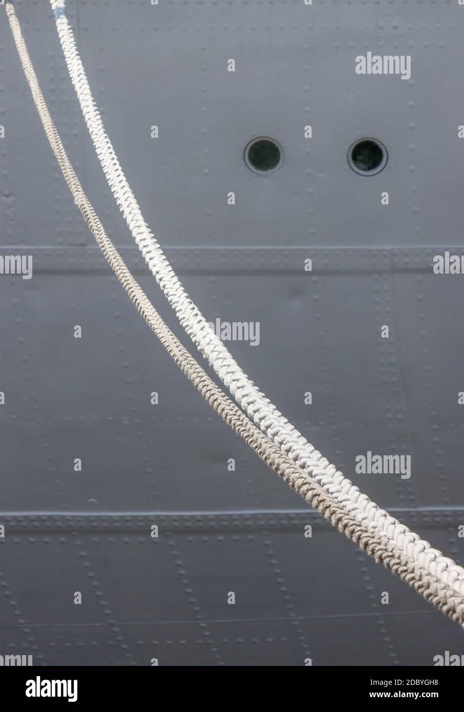 Ship hull with portholes and mooring lines Stock Photo - Alamy
