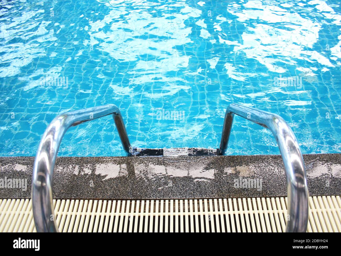 Grab bars ladder in the blue swimming pool Stock Photo - Alamy