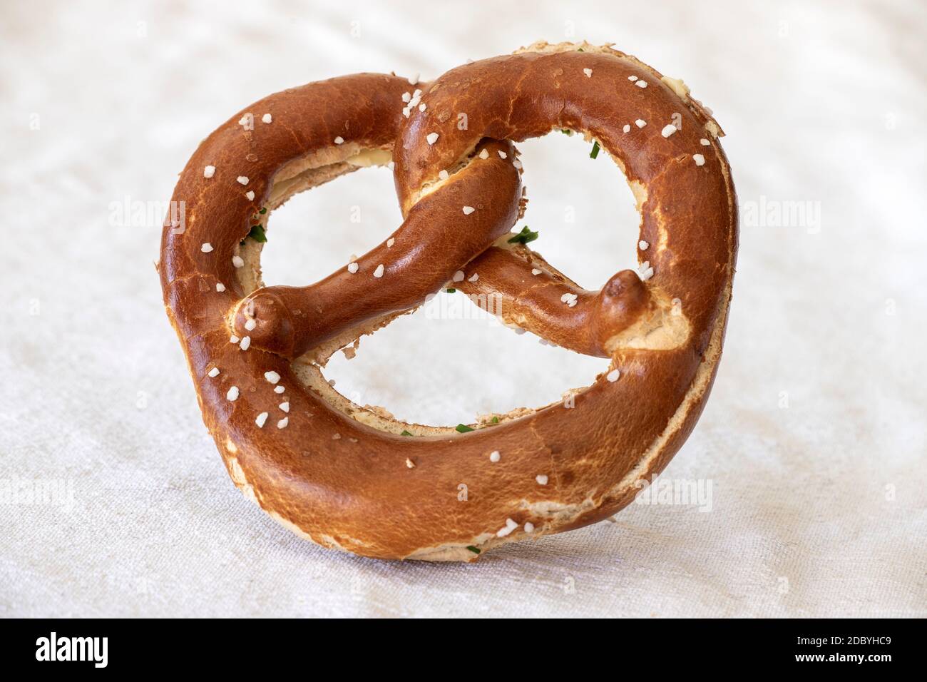 bavarian pretzel with butter on white Stock Photo Alamy