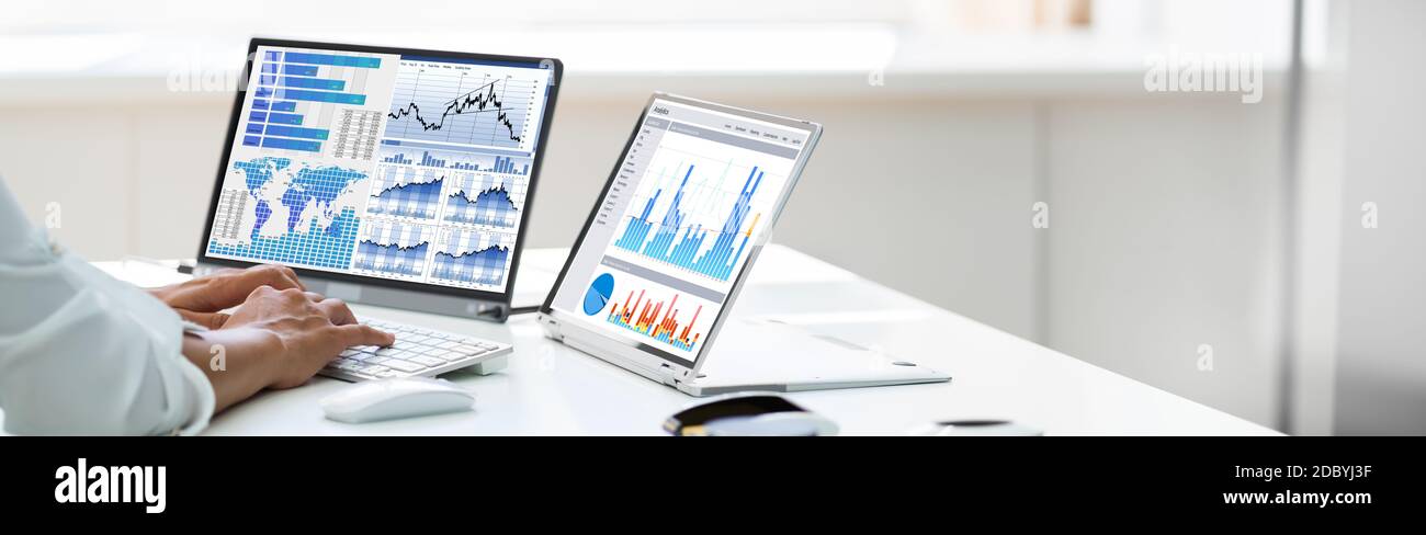 Analyst Employee Working With Spreadsheet Report On Laptop Screen Stock Photo