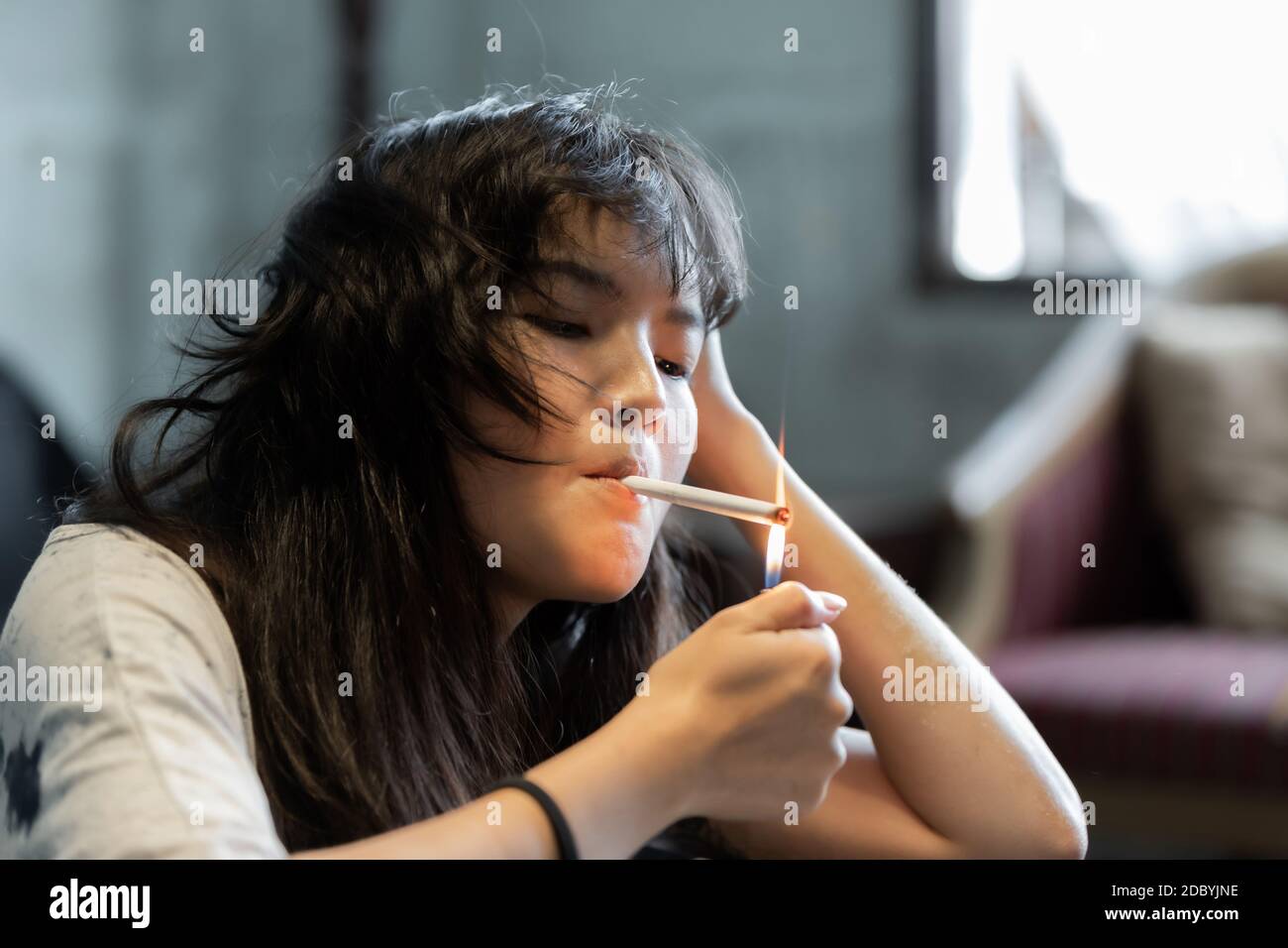 Asian girl smoking and hopeless concept, feeling be absent-minded ...