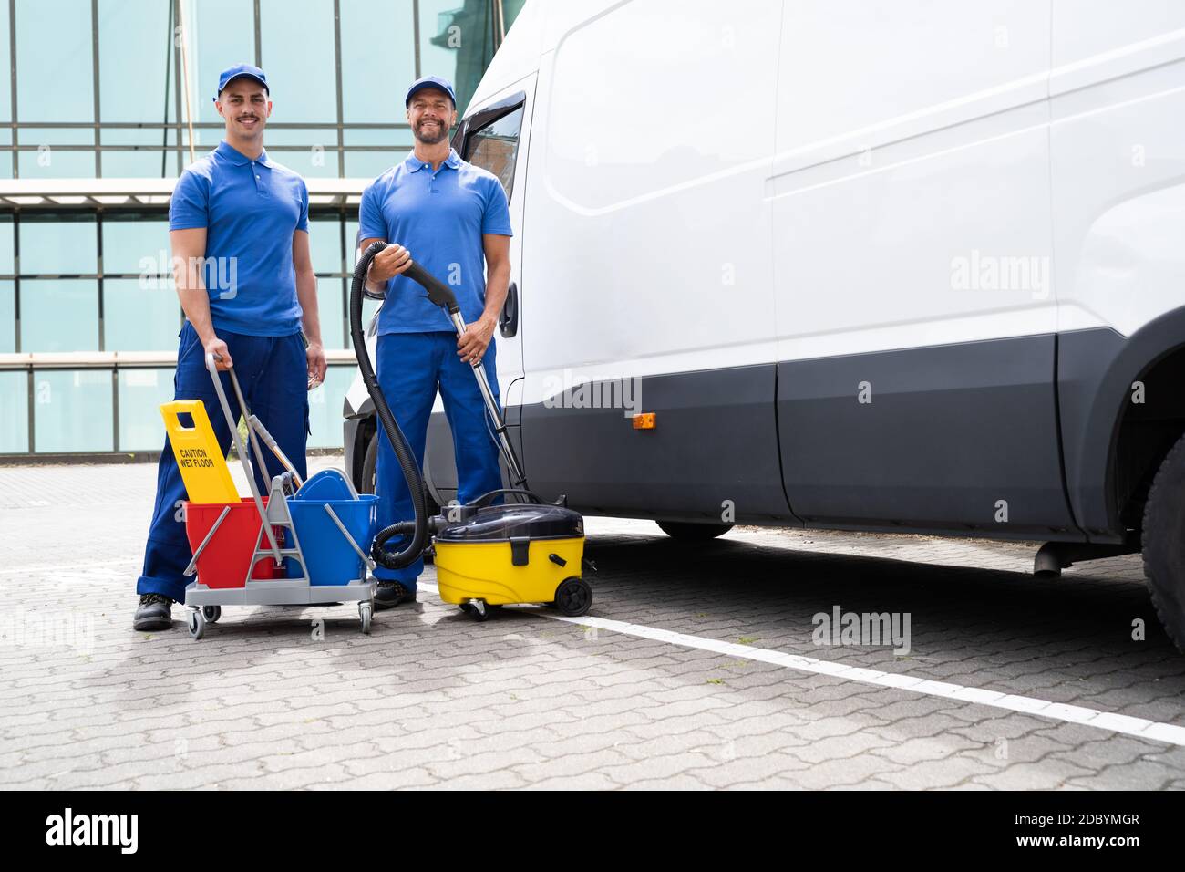 Guy With Vacuum Cleaner And Worker Near Truck Stock Photo Alamy