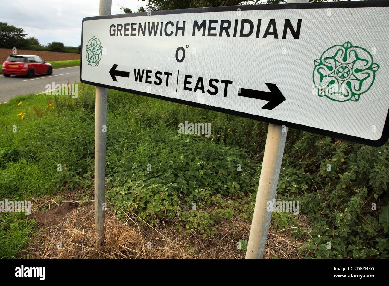 Sign indicating the line of the Greenwich Meridian near Welwick, East Yorkshire, UK Stock Photo