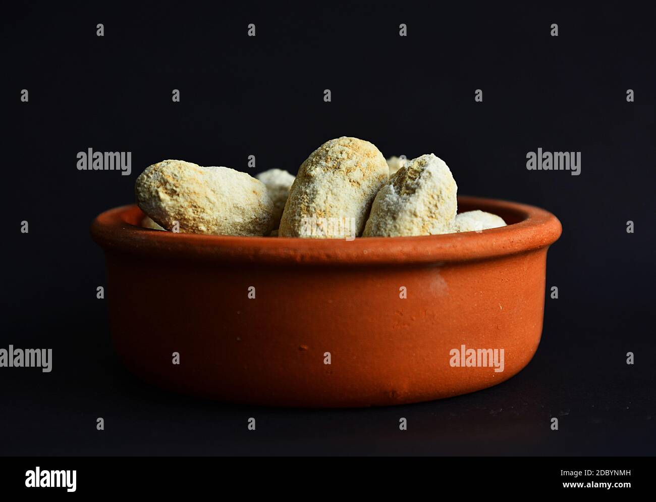 Shelled peanuts salted in clay pot Stock Photo