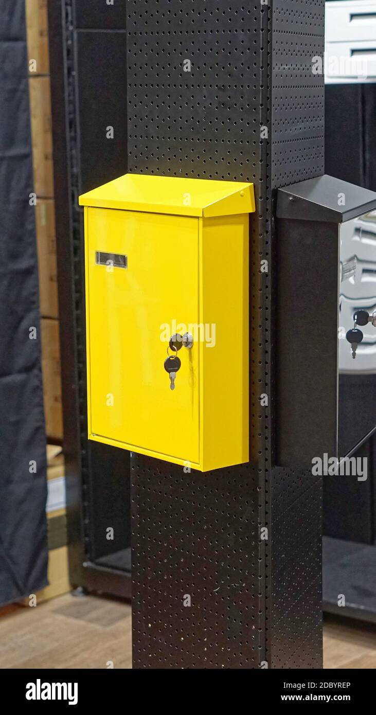 Bright yellow mail box with keys Stock Photo Alamy