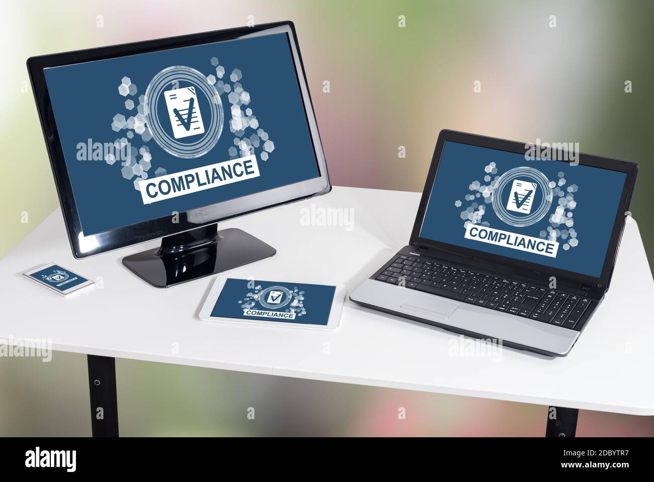 Compliance concept shown on different information technology devices Stock Photo