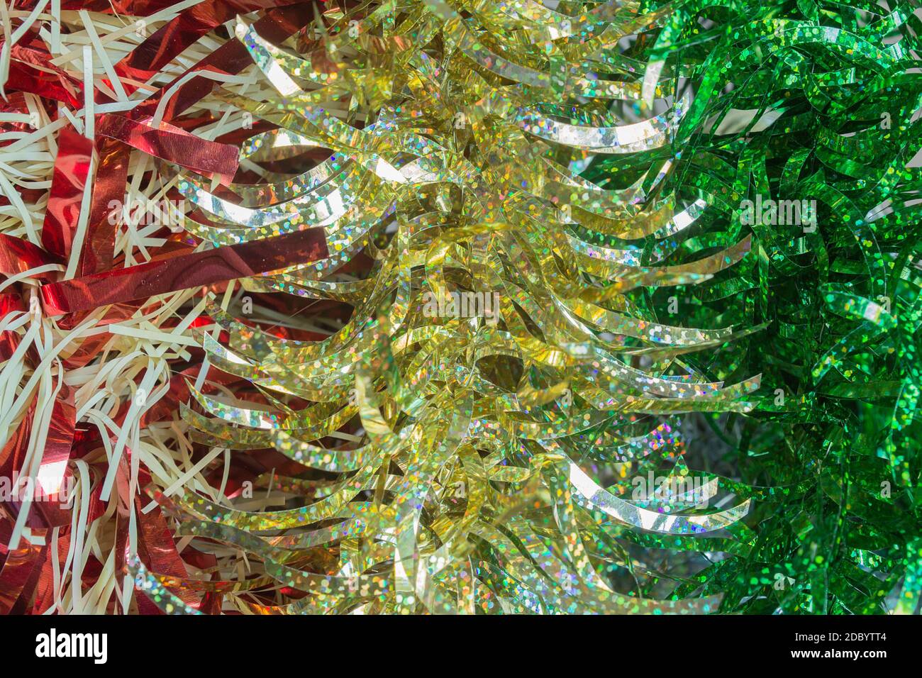 A fringed strip of a type of tissue or shiny paper that is used to decorate, especially the Christmas tree. Stock Photo