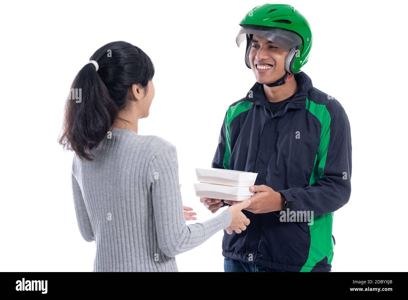 woman ordering food online delivered by courier wearing uniform