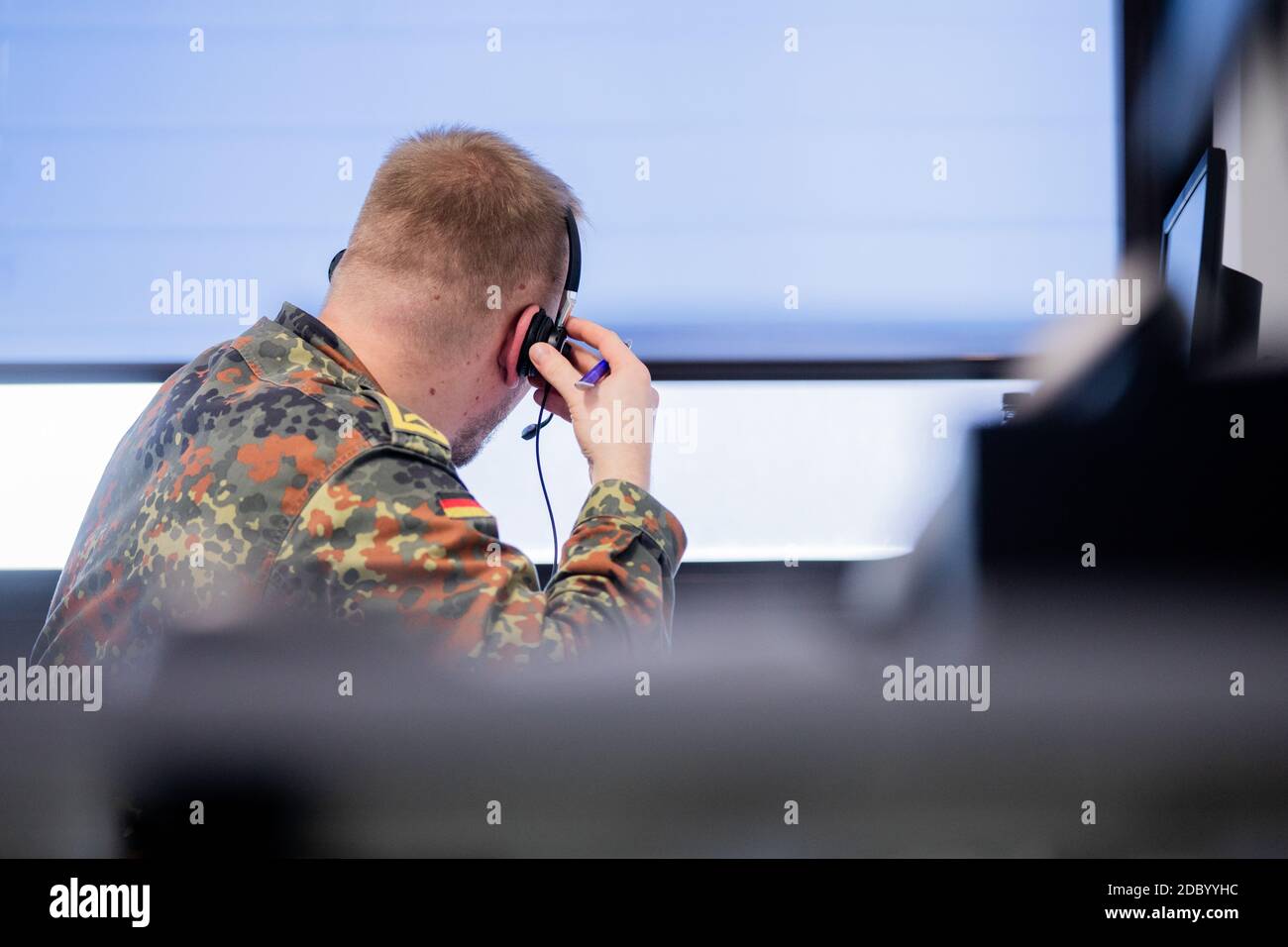 Grevenbroich, Germany. 18th Nov, 2020. A Bundeswehr soldier makes a phone call during contact tracing at the public health department. This is also where Bundeswehr soldiers are trained for Corona assistance. Credit: Rolf Vennenbernd/dpa/Alamy Live News Stock Photo
