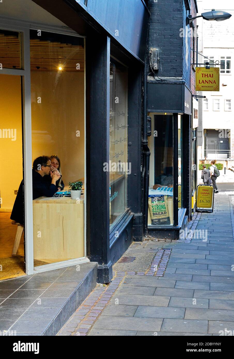 Bridewell Alley with couple in cafe of bakers Stock Photo Alamy