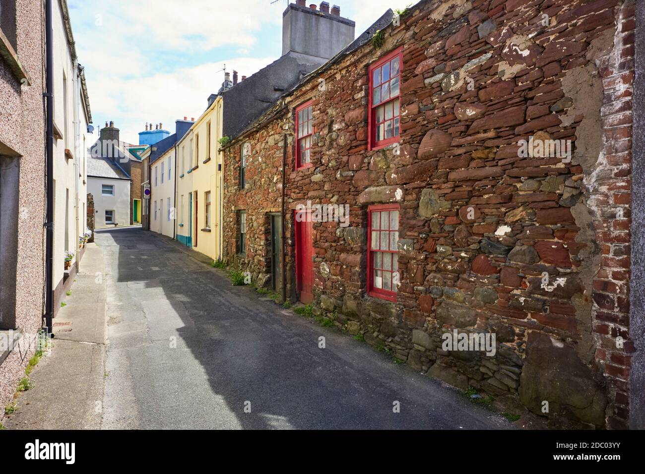 Strand Street in Peel with old cottages in red sandstone in foreground Stock Photo