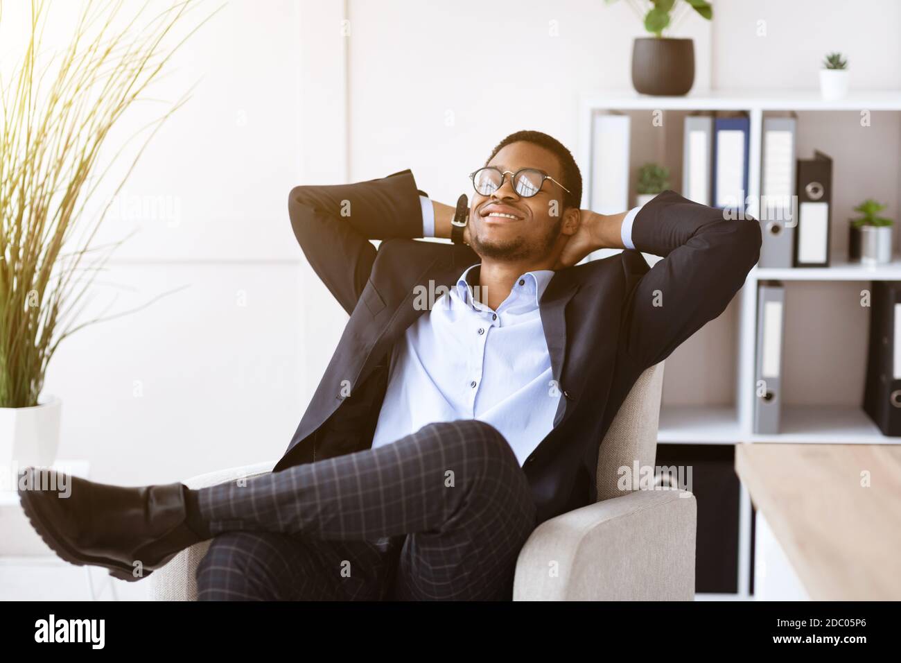 Relaxed black businessman resting in his office Stock Photo