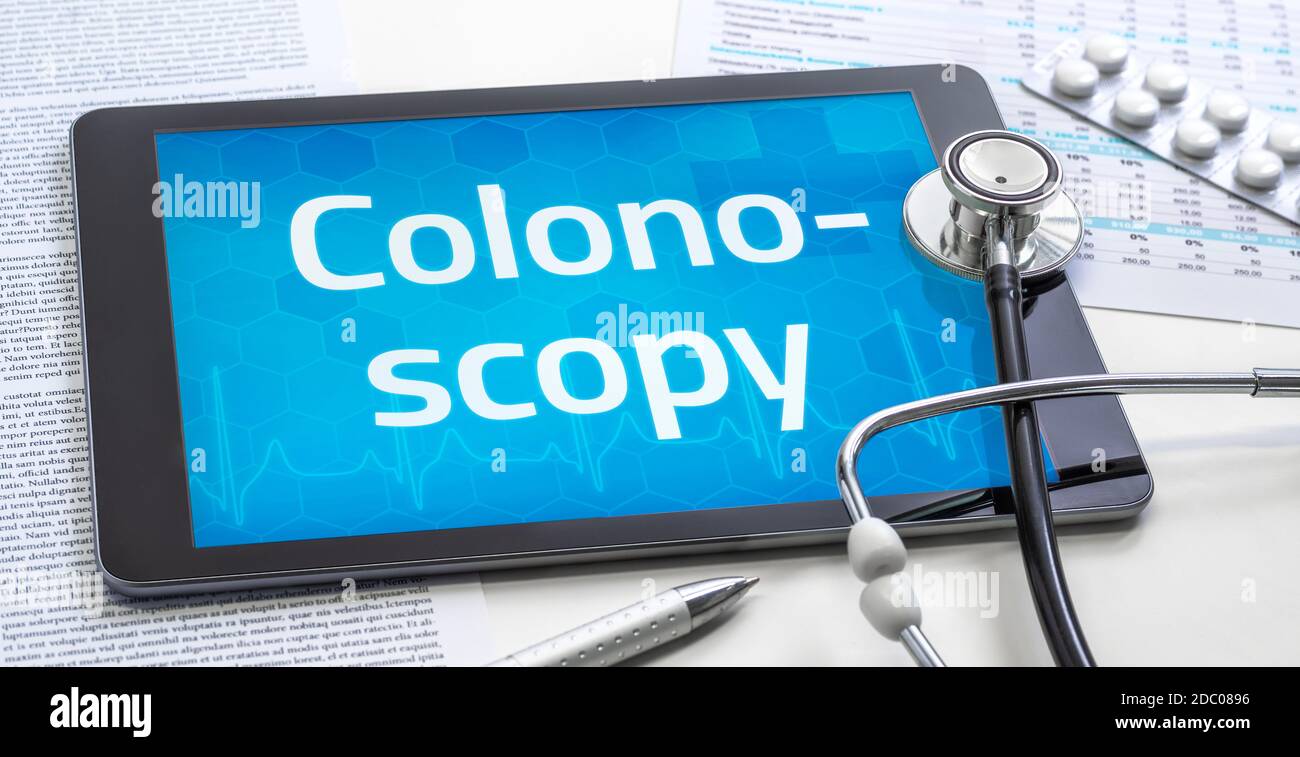The word Colonoscopy on the display of a tablet Stock Photo