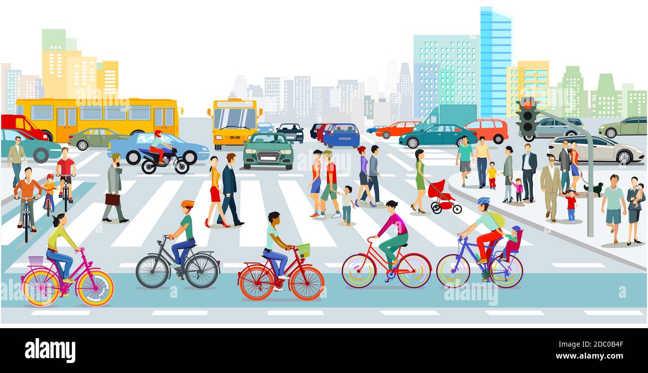 Cyclists on the bike path in the city with road traffic and pedestrians Stock Photo