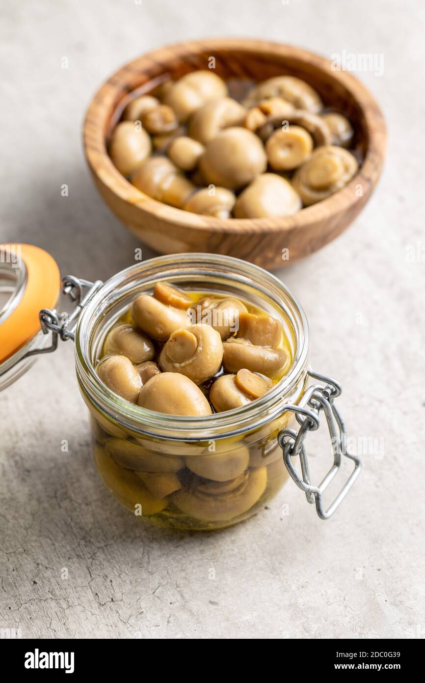Pickled champignons. Marinated mushrooms in jar Stock Photo Alamy