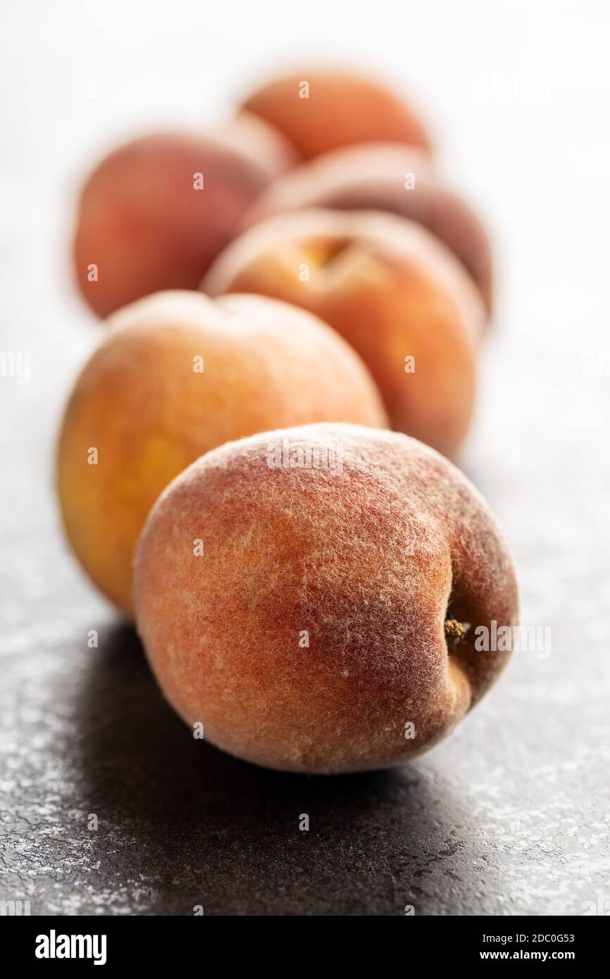 Fresh ripe bio peaches on black table. Stock Photo